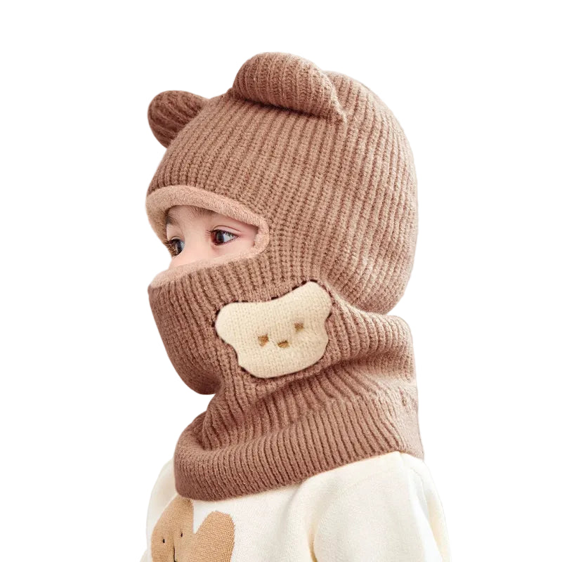 Cagoule Bébé Fille Marron sur fond blanc de profil porter par un bebe