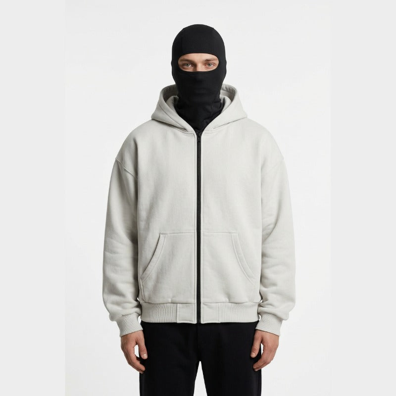 Cagoule Veste Grise portée sur fond blanc